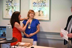 Carolyn Dow receives Paul Harris +